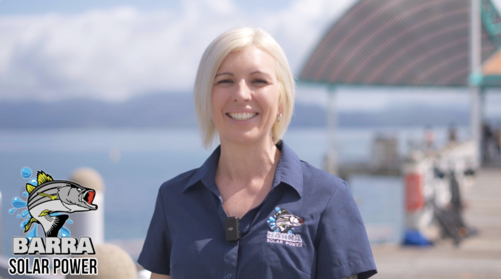 Blonde girl on Jetty in Townsville with Barra Solar Power logo